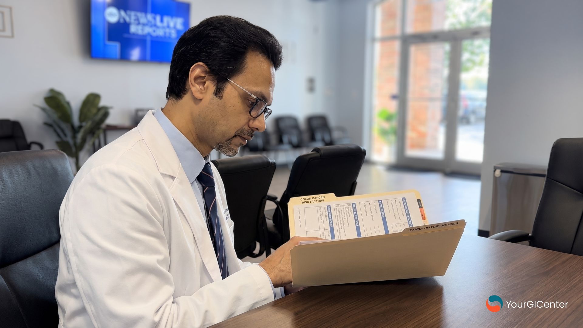A professional gastroenterologist evaluating a physical family history medical chart to analyze patient eligibility for colon cancer screening in Houston.