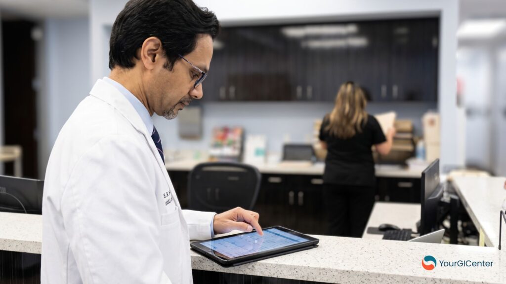 A GI specialist utilizing digital tracking tablets and advanced medical screening options to detect and remove colon polyps during a clinical procedure.