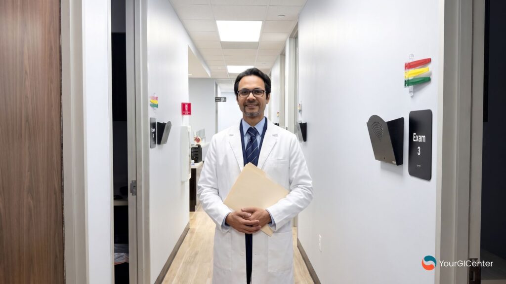 A dedicated gastroenterologist friendswood tx standing inside a brand-aligned clinic hallway at Your GI Center to evaluate liver health warning signs for a local gi doctor alvin texas patient.