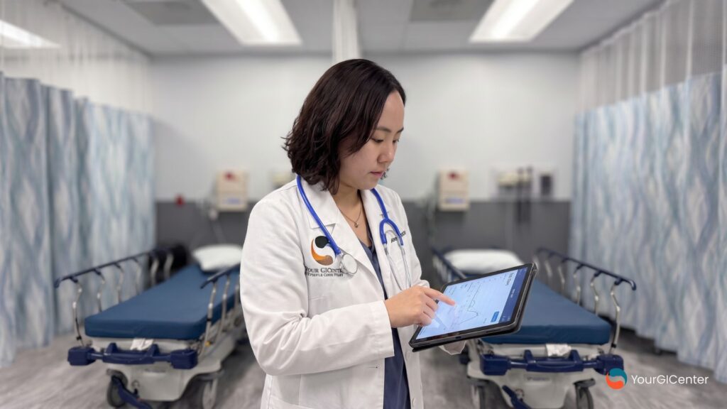 A specialized GI care utilizing a digital clinical interface to manage lifestyle adjustments and treatment options at a dedicated health facility.