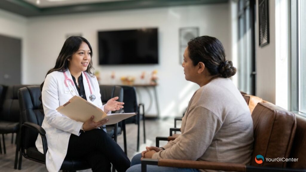 A supportive gi specialist pearland nurse practitioner engaging in a clinical care consultation with a patient inside a premium medical center managed by a top gastroenterologist pearland tx.